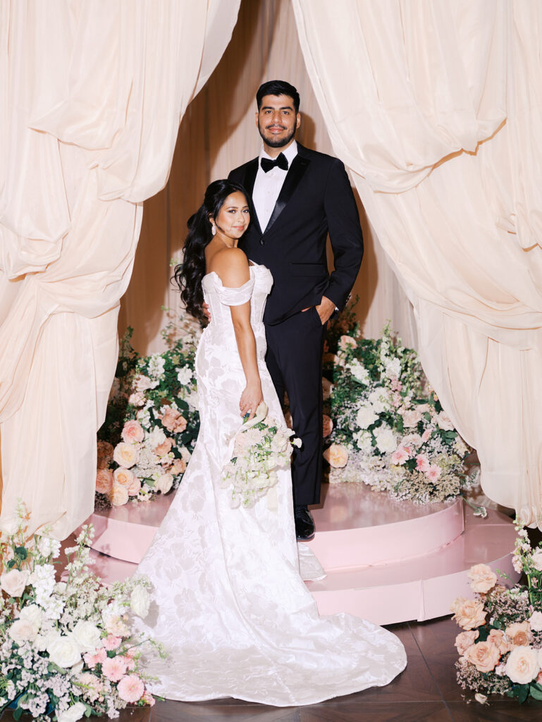 Bride and groom portrait at Villa Antonia with pink florals, captured by Kelsey Applebaum Photography