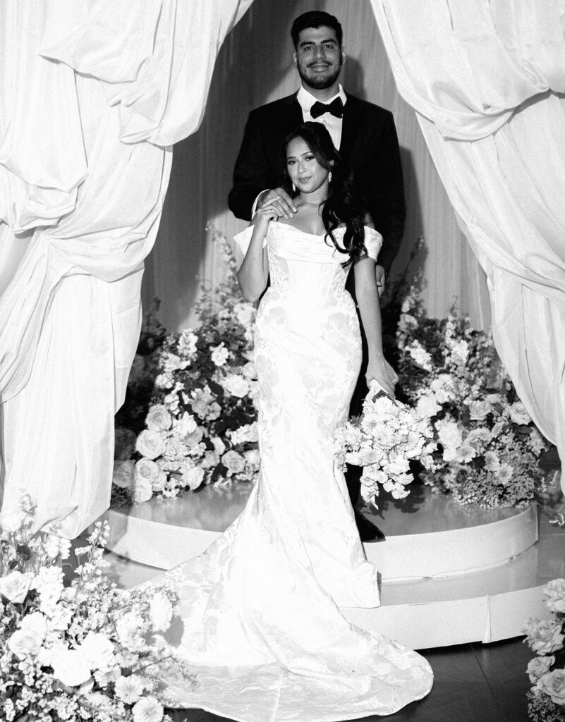 Bride and groom portrait at Villa Antonia with pink florals, captured by Kelsey Applebaum Photography