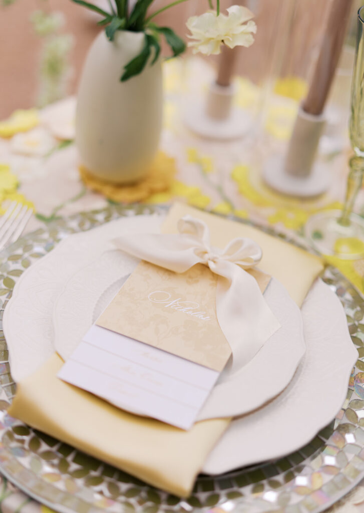 Yellow reception table with garden-inspired florals and romantic details at Villa Antonia, photographed on film by Kelsey Applebaum