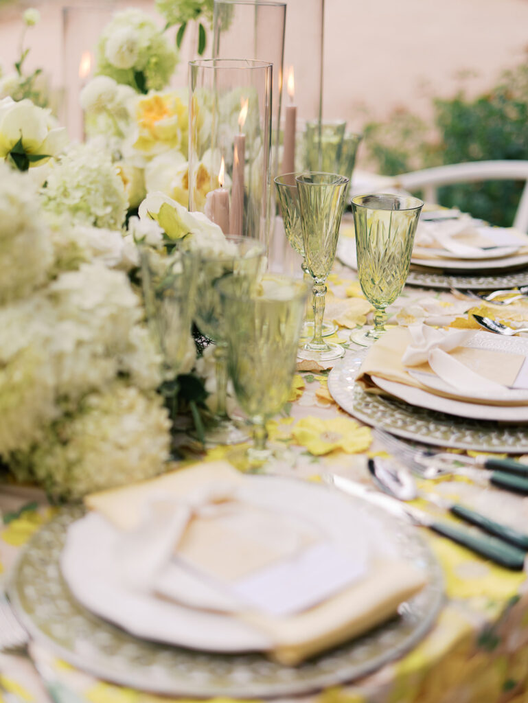 Yellow reception table with garden-inspired florals and romantic details at Villa Antonia, photographed on film by Kelsey Applebaum