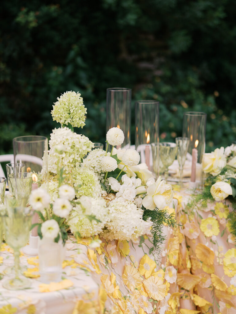 Yellow reception table with garden-inspired florals and romantic details at Villa Antonia, photographed on film by Kelsey Applebaum