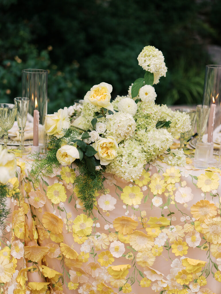 Yellow reception table with garden-inspired florals and romantic details at Villa Antonia, photographed on film by Kelsey Applebaum
