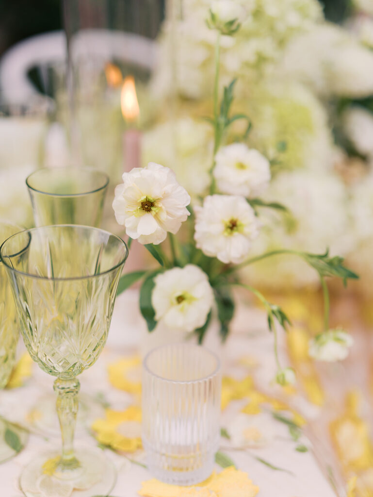 Yellow reception table with garden-inspired florals and romantic details at Villa Antonia, photographed on film by Kelsey Applebaum