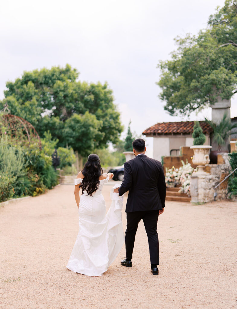 Romantic ceremony moment at Villa Antonia with lush florals by Truth & Blooms, planning by Simply XO Events, photographed by Kelsey Applebaum