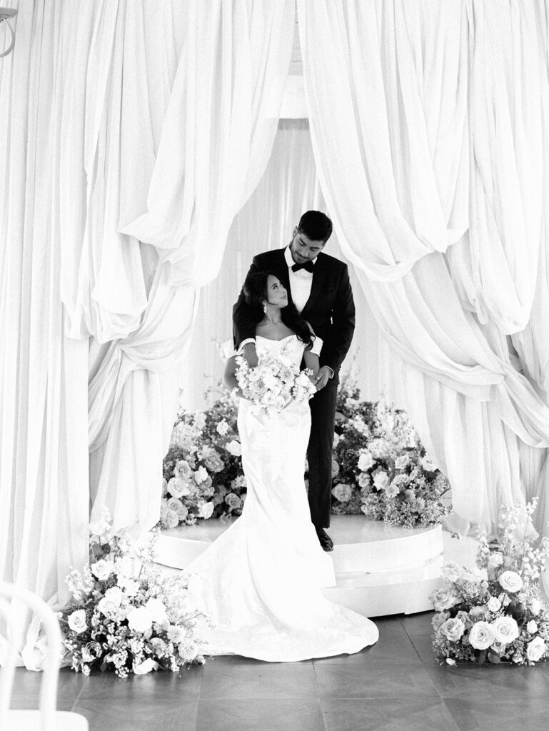 Bride and groom portrait at Villa Antonia with pink florals, captured by Kelsey Applebaum Photography