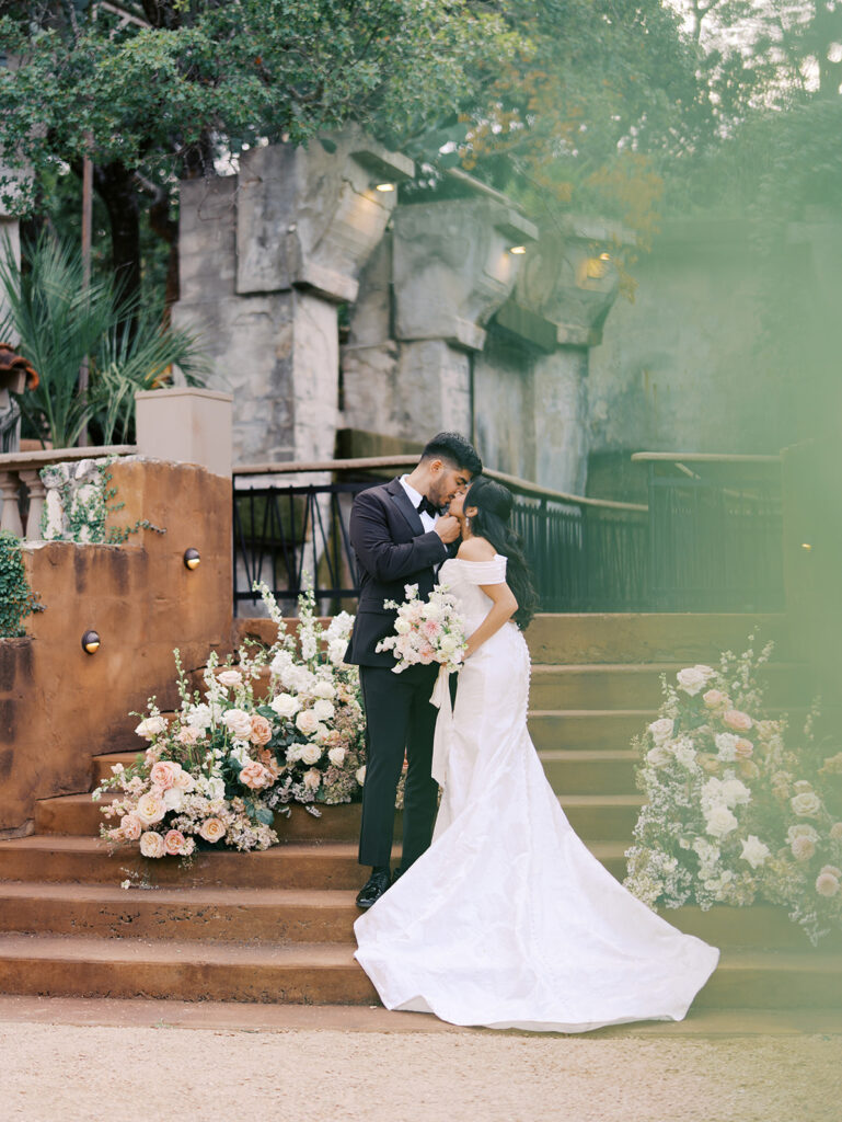 Romantic ceremony moment at Villa Antonia with lush florals by Truth & Blooms, planning by Simply XO Events, photographed by Kelsey Applebaum