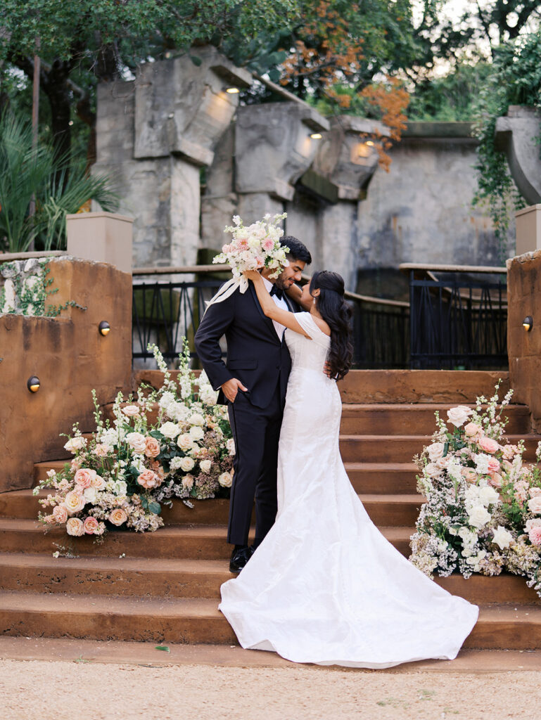 Romantic ceremony moment at Villa Antonia with lush florals by Truth & Blooms, planning by Simply XO Events, photographed by Kelsey Applebaum