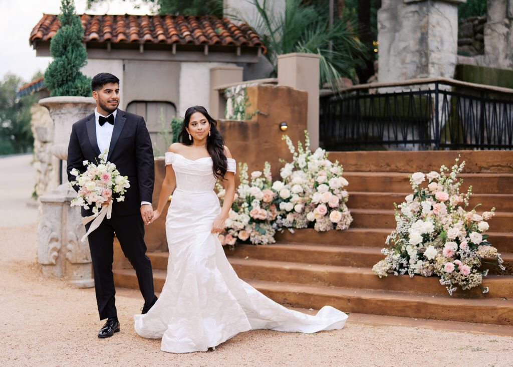Romantic ceremony moment at Villa Antonia with lush florals by Truth & Blooms, planning by Simply XO Events, photographed by Kelsey Applebaum