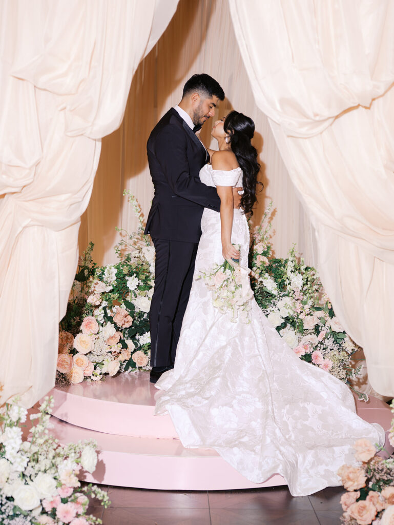 Bride and groom portrait at Villa Antonia with pink florals, captured by Kelsey Applebaum Photography