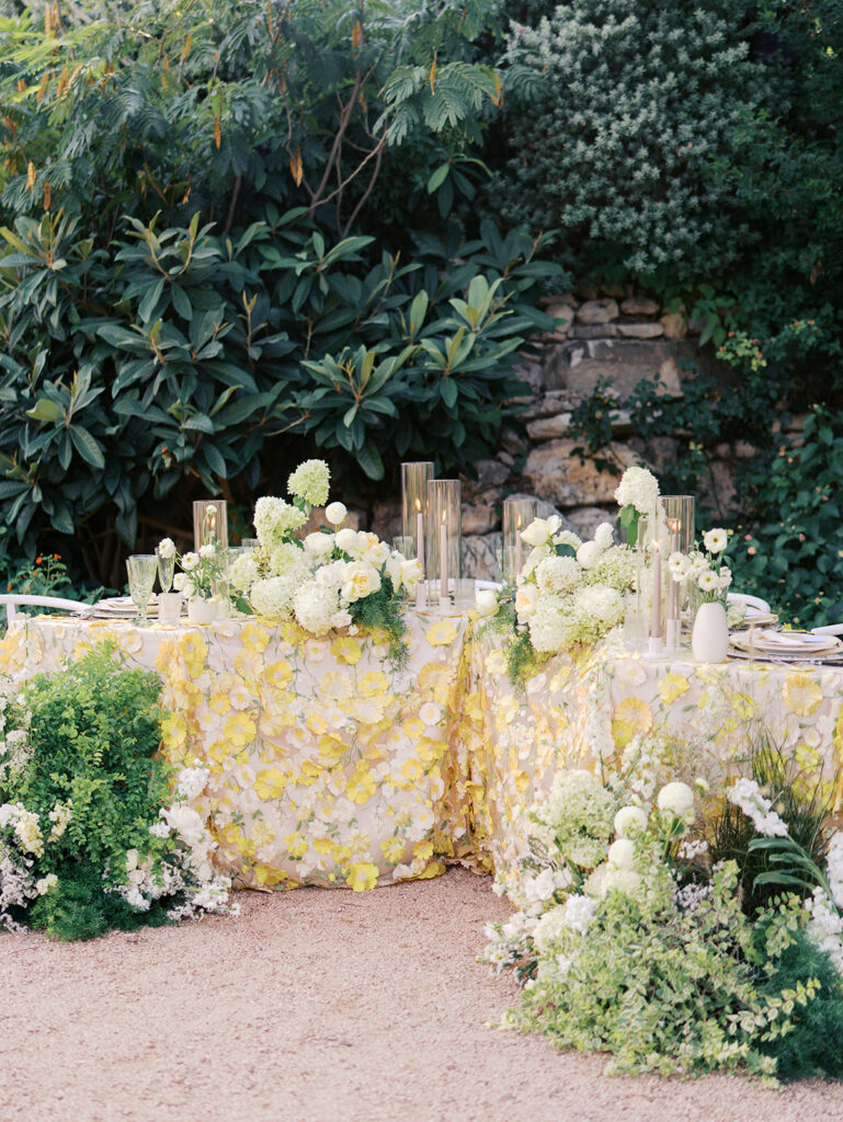 Wedding tablescape with pastel yellow linens and roses at Villa Antonia, photographed by Kelsey Applebaum