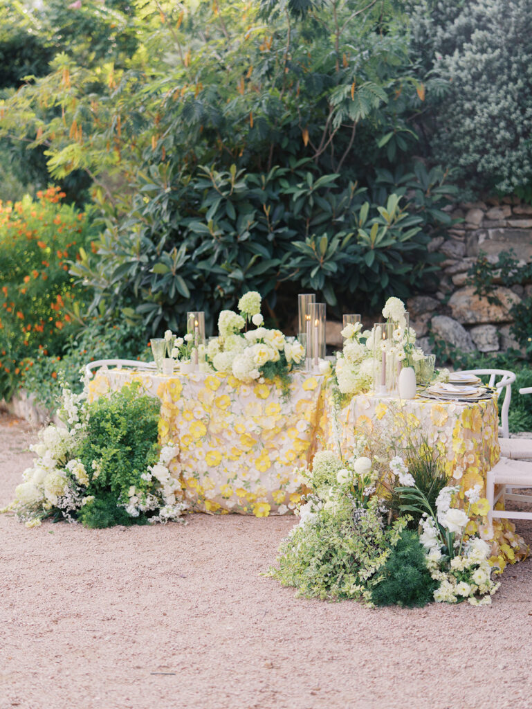 Wedding tablescape with pastel yellow linens and roses at Villa Antonia, photographed by Kelsey Applebaum