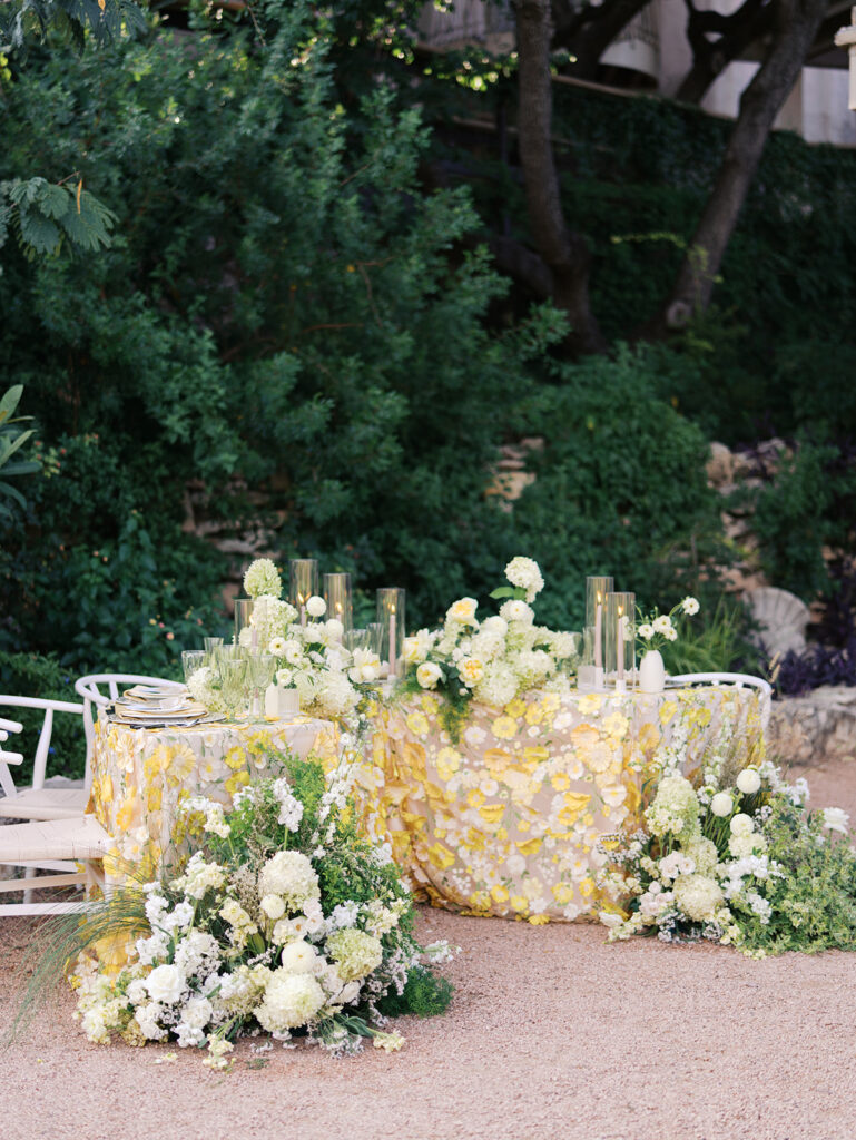 Wedding tablescape with pastel yellow linens and roses at Villa Antonia, photographed by Kelsey Applebaum