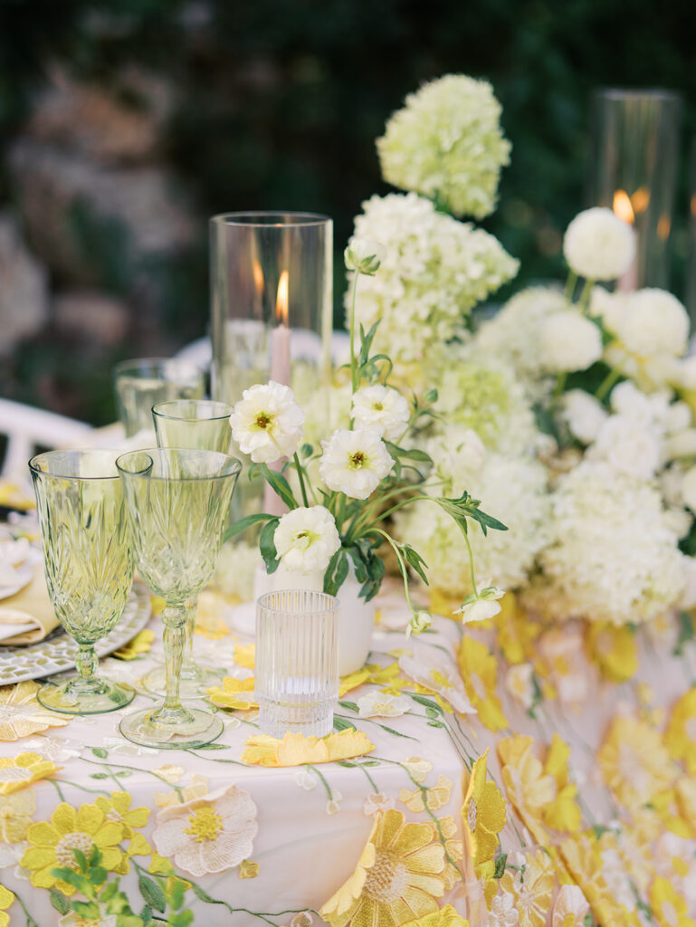 Wedding tablescape with pastel yellow linens and roses at Villa Antonia, photographed by Kelsey Applebaum