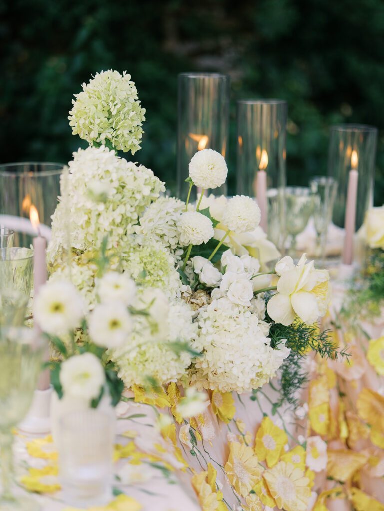 Wedding tablescape with pastel yellow linens and roses at Villa Antonia, photographed by Kelsey Applebaum