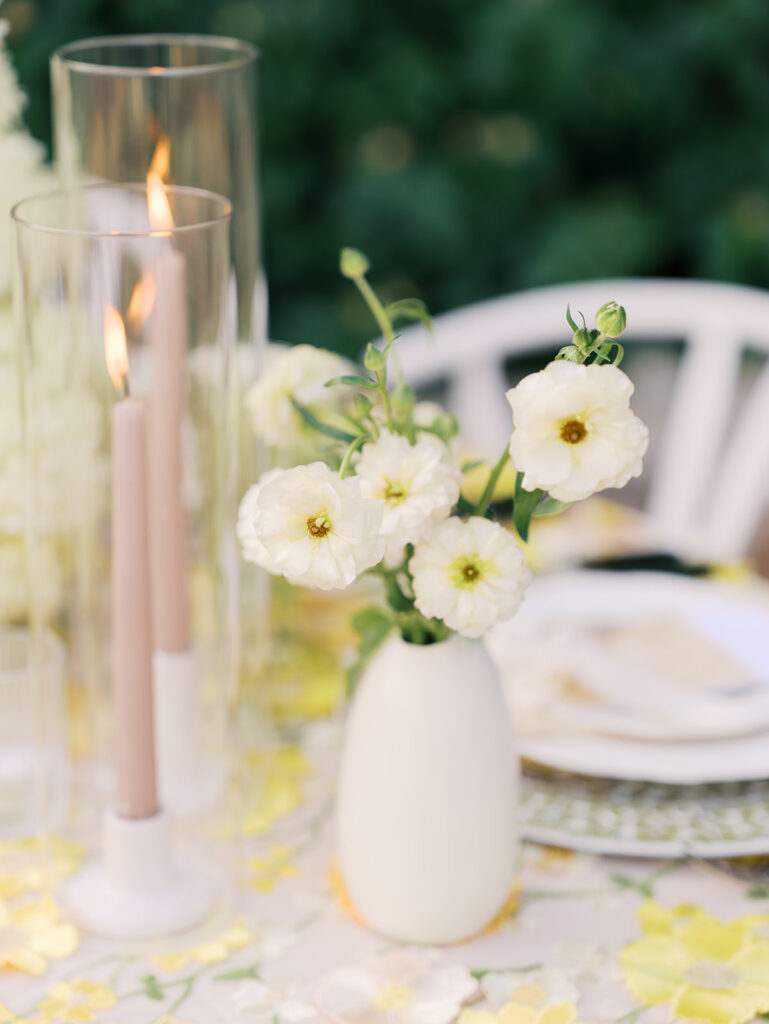 Wedding tablescape with pastel yellow linens and roses at Villa Antonia, photographed by Kelsey Applebaum