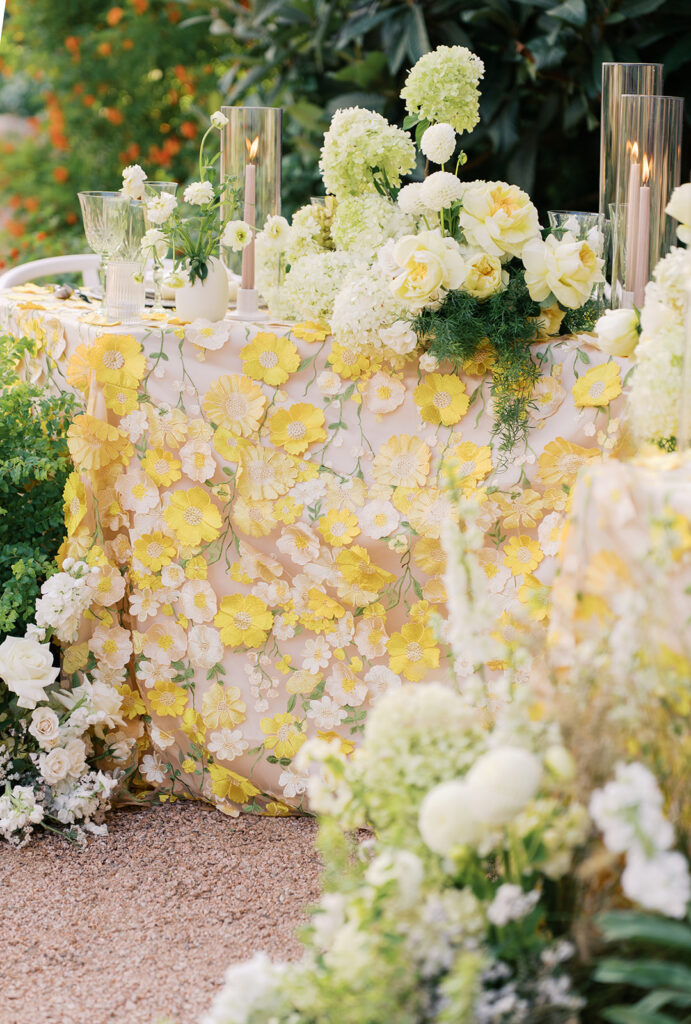 Wedding tablescape with pastel yellow linens and roses at Villa Antonia, photographed by Kelsey Applebaum