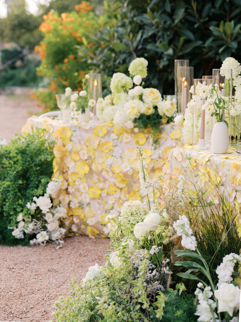 Wedding tablescape with pastel yellow linens and roses at Villa Antonia, photographed by Kelsey Applebaum