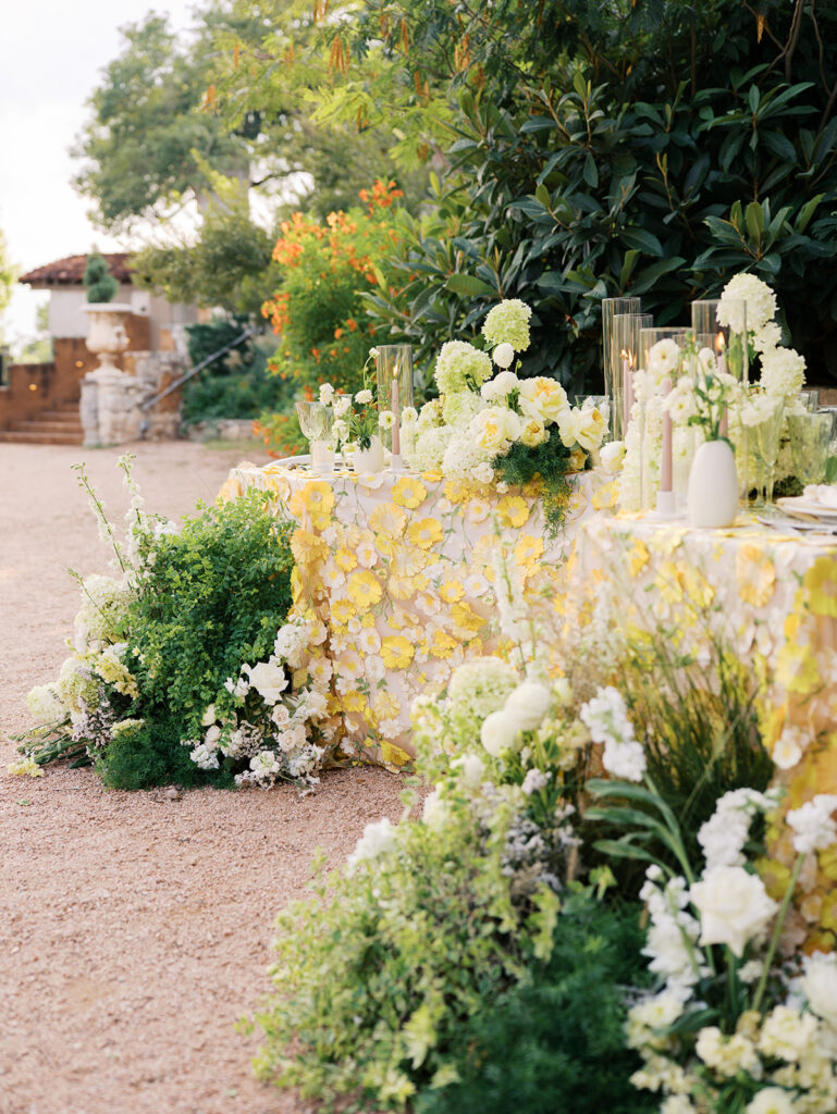 Wedding tablescape with pastel yellow linens and roses at Villa Antonia, photographed by Kelsey Applebaum
