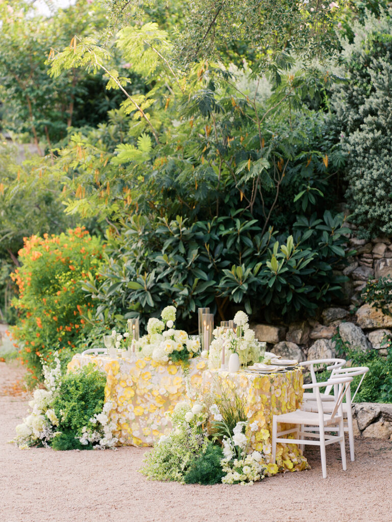 Wedding tablescape with pastel yellow linens and florals by Truth & Blooms at Villa Antonia, photographed by Kelsey Applebaum