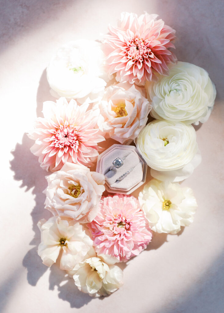Wedding details flatlay with invitation suite and floral styling at Villa Antonia, photographed by Kelsey Applebaum