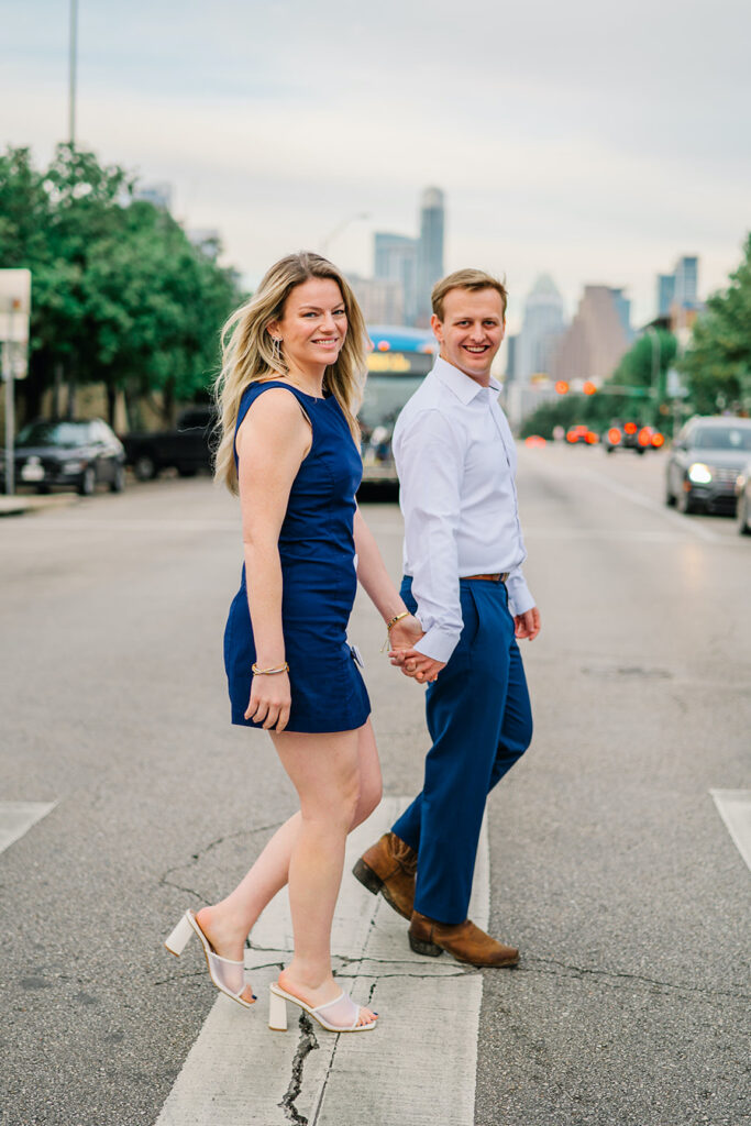 engagement session on the iconic south congress on film bride and groom walking