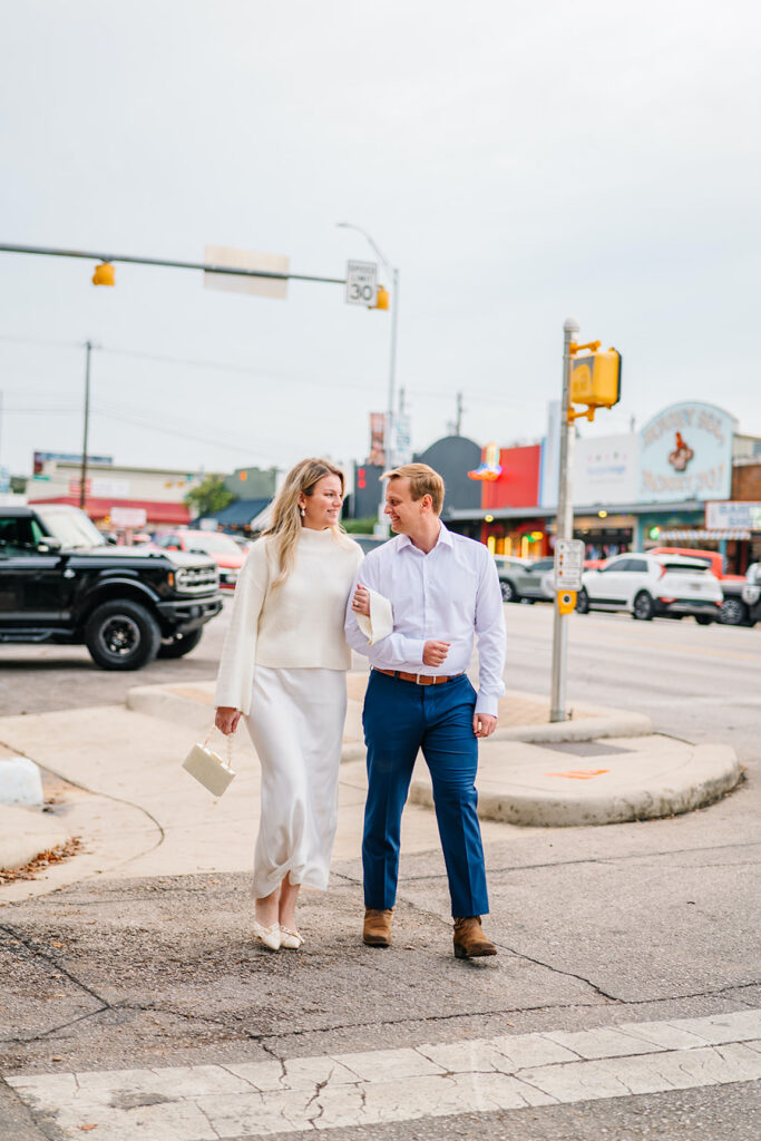 engagement session on the iconic south congress on film bride and groom walking