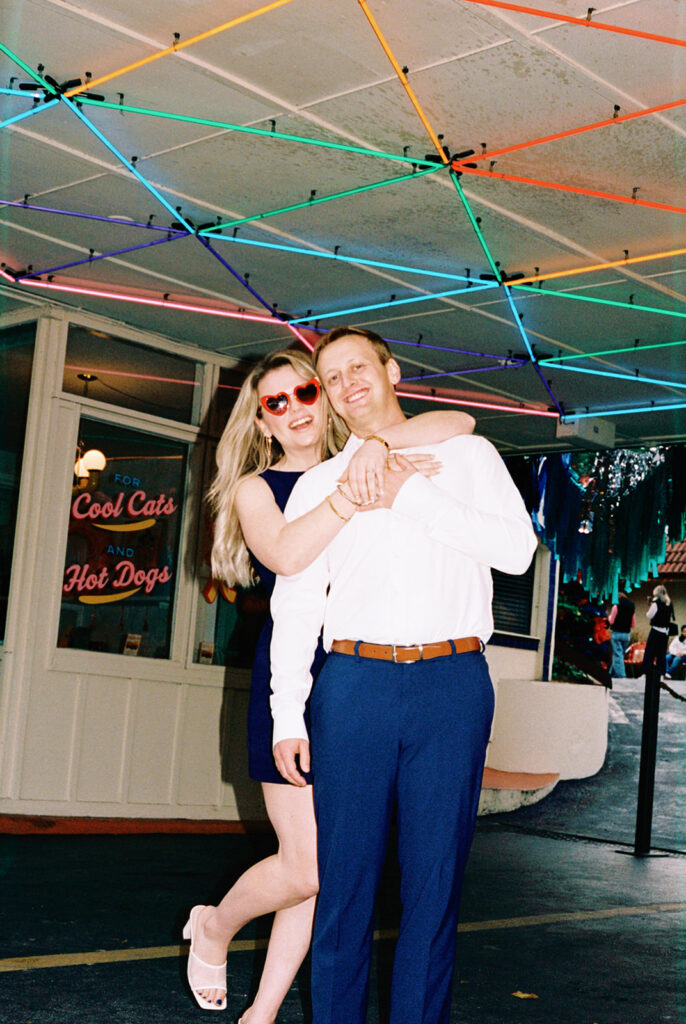 engagement session on the iconic south congress on film bride and groom walking