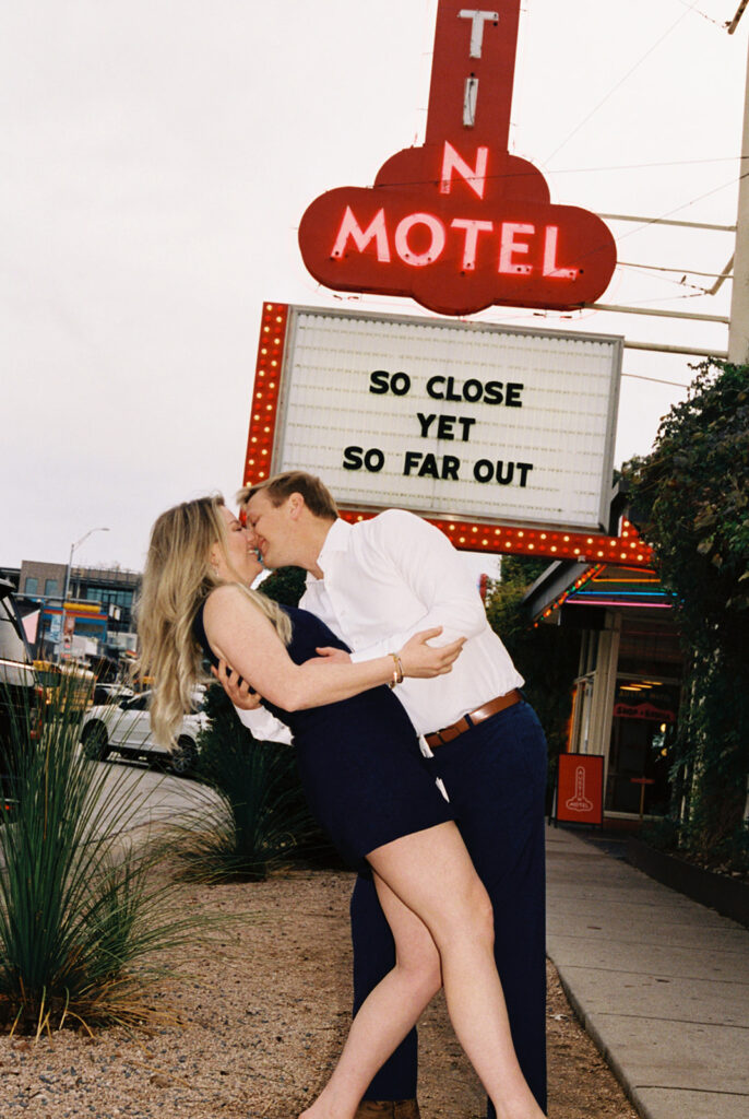 engagement session on the iconic south congress on film bride and groom walking