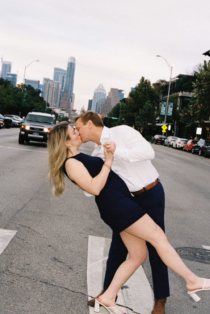 engagement session on the iconic south congress on film bride and groom walking