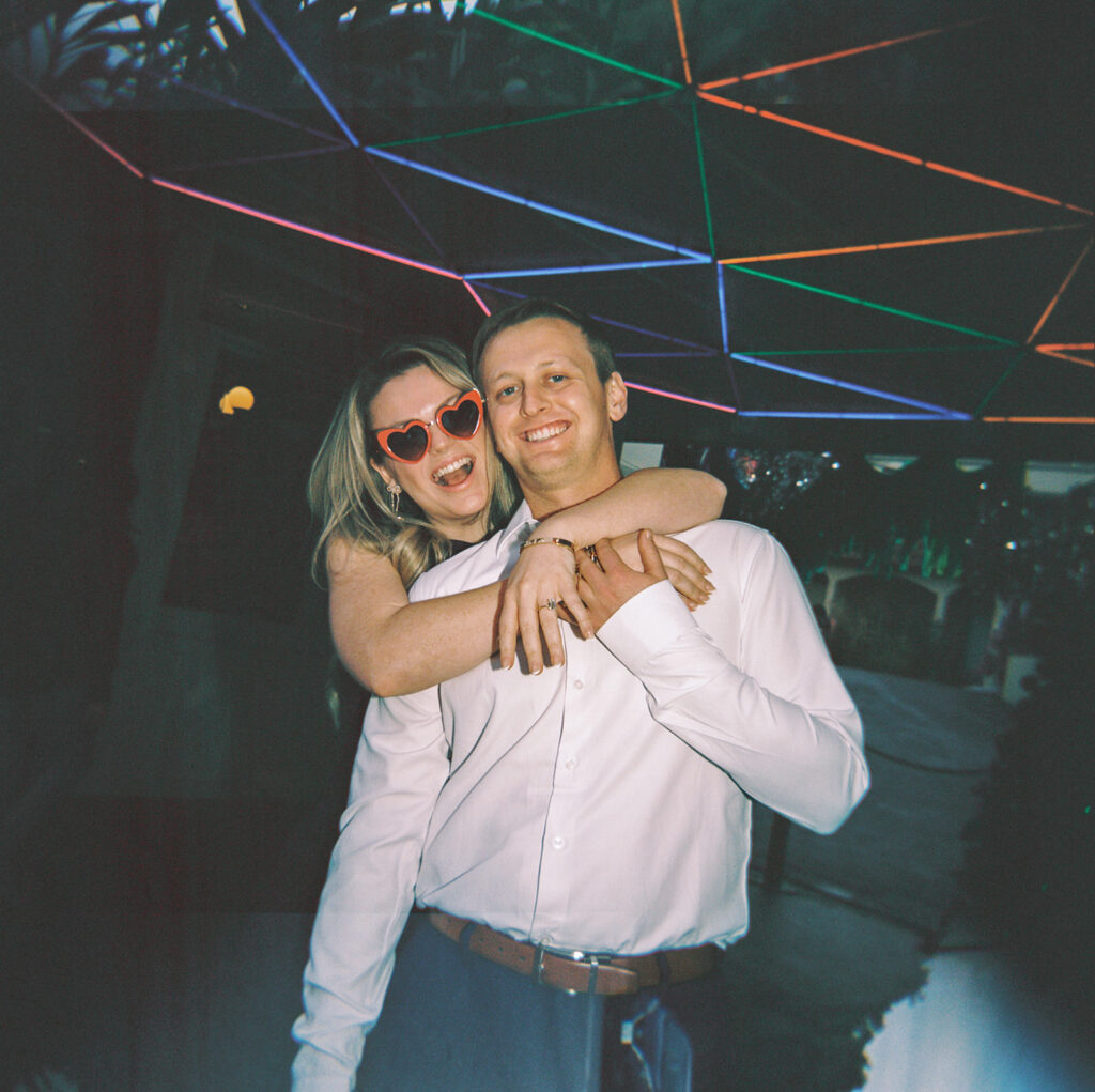 engagement session on the iconic south congress on film bride and groom walking