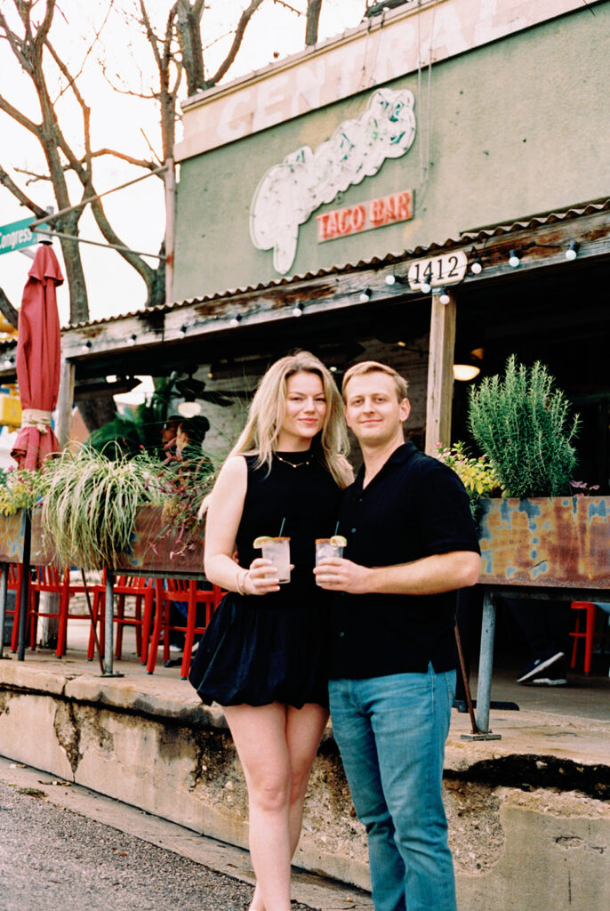 engagement session on the iconic south congress on film bride and groom walking