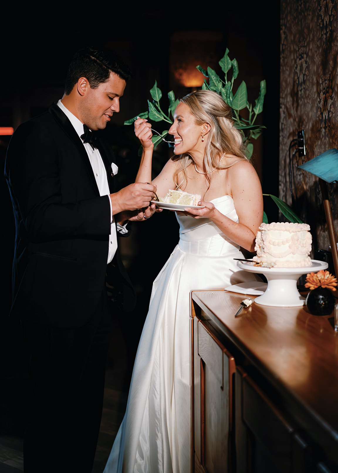 bride and groom cake cutting at wedding