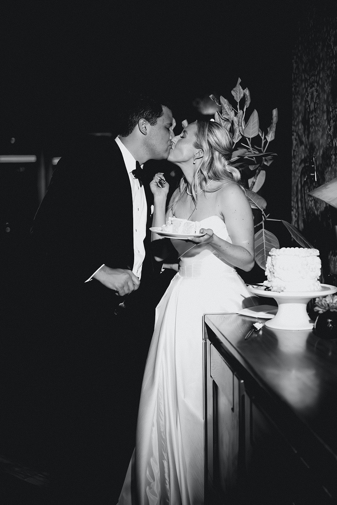 bride and groom cake cutting at wedding