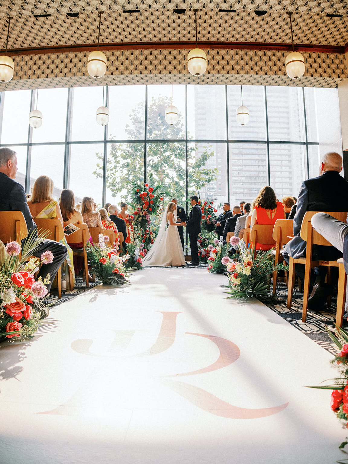 lush floral ceremony for a wedding at the austin proper
