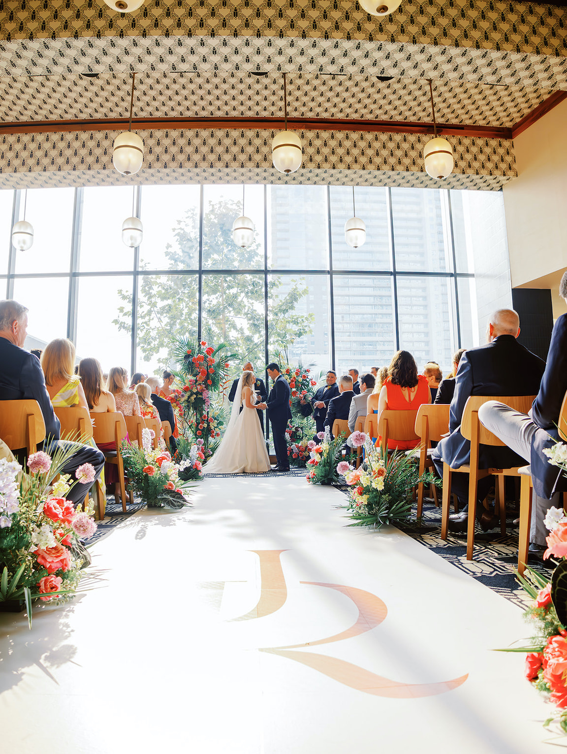 lush floral ceremony for a wedding at the austin proper