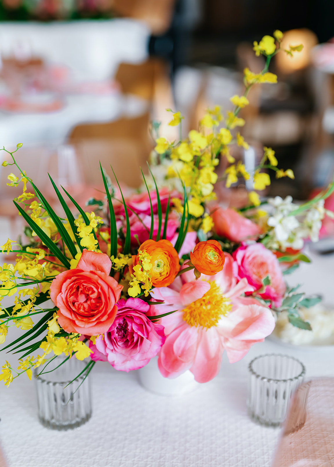 lush vibrant flowers for a wedding at the austin proper reception details
