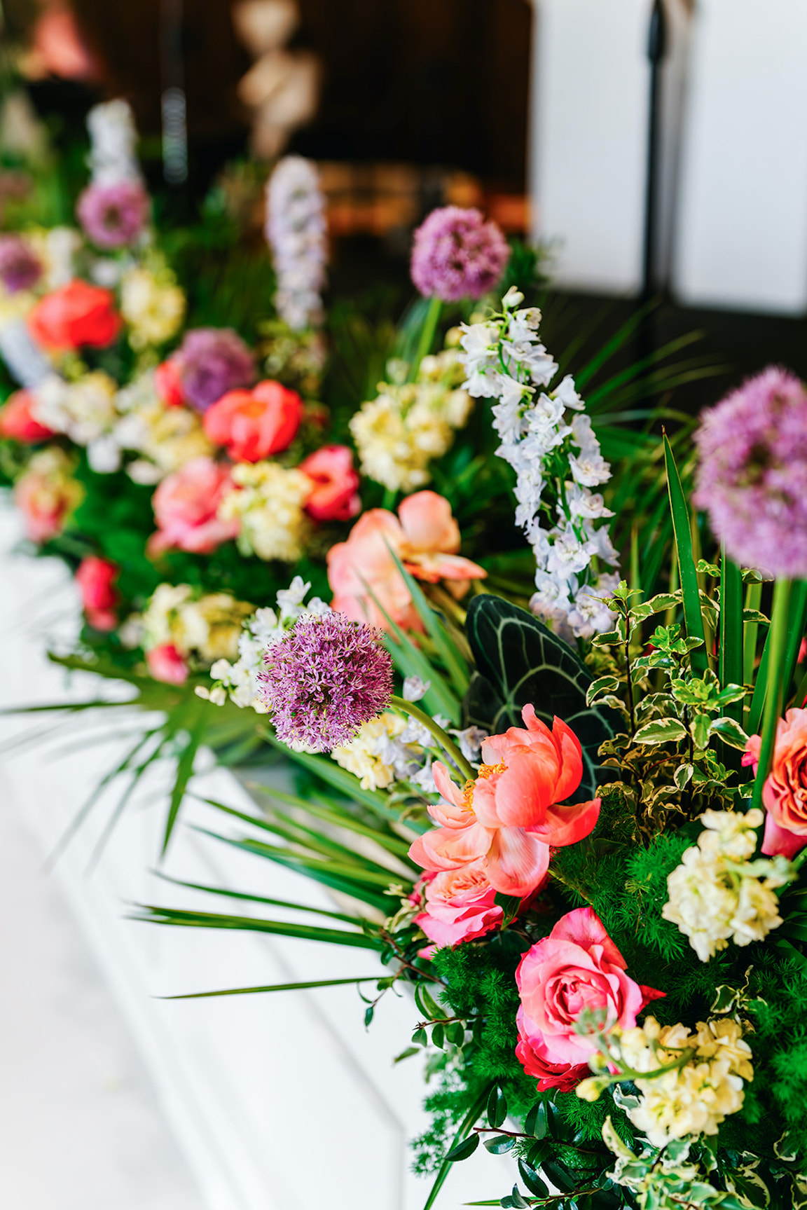 lush vibrant flowers for a wedding at the austin proper reception details