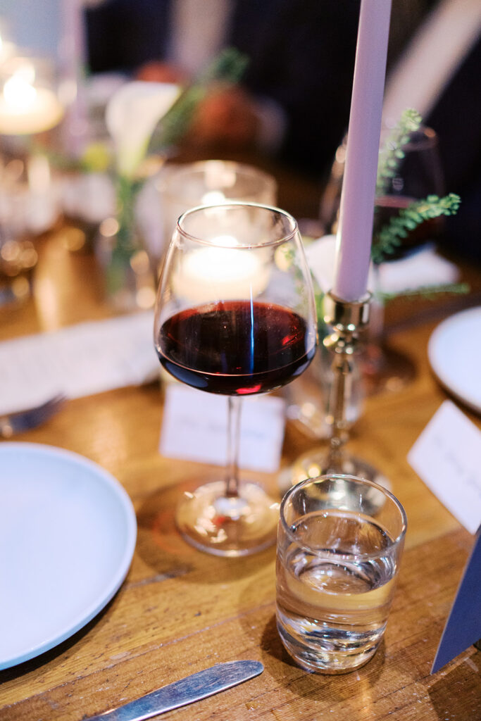 Film photograph of rehearsal dinner guests enjoying an intimate evening at Intero Restaurant.