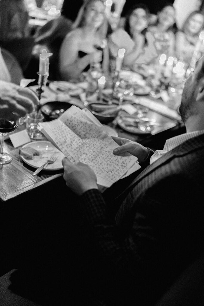 Film photograph of rehearsal dinner guests enjoying an intimate evening at Intero Restaurant.