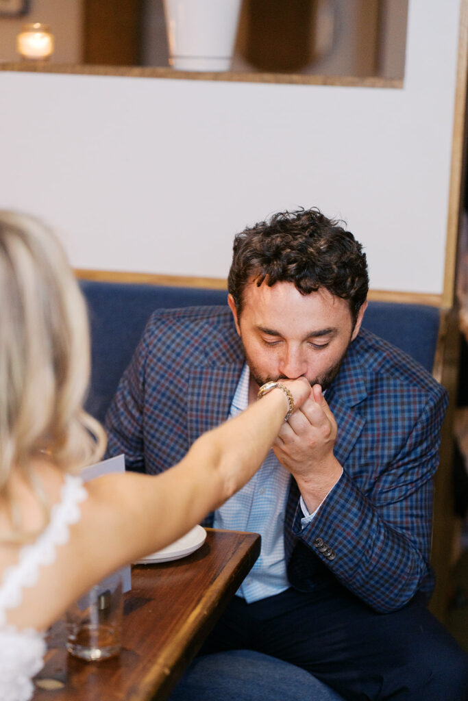 Film photograph of rehearsal dinner guests enjoying an intimate evening at Intero Restaurant.