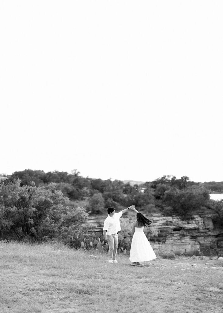 Playful and candid Lake Travis proposal photography of newly engaged couple enjoying the moment together.