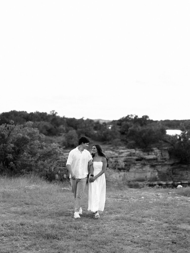 Playful and candid Lake Travis proposal photography of newly engaged couple enjoying the moment together.