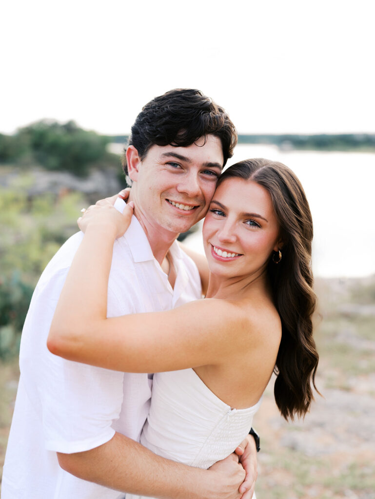 Playful and candid Lake Travis proposal photography of newly engaged couple enjoying the moment together.