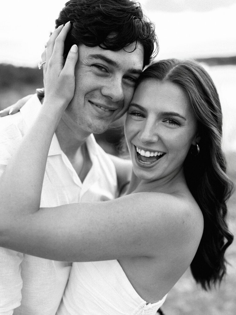 Playful and candid Lake Travis proposal photography of newly engaged couple enjoying the moment together.