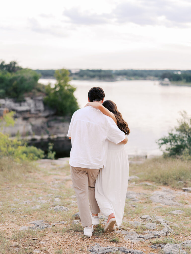 Playful and candid Lake Travis proposal photography of newly engaged couple enjoying the moment together.