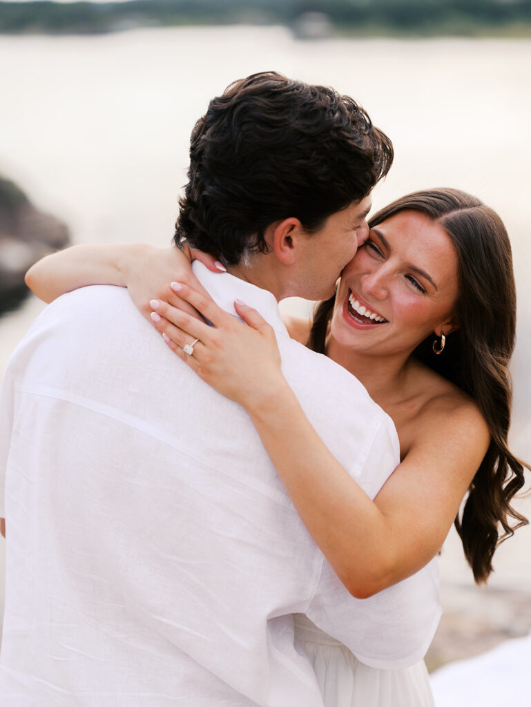 Playful and candid Lake Travis proposal photography of newly engaged couple enjoying the moment together.