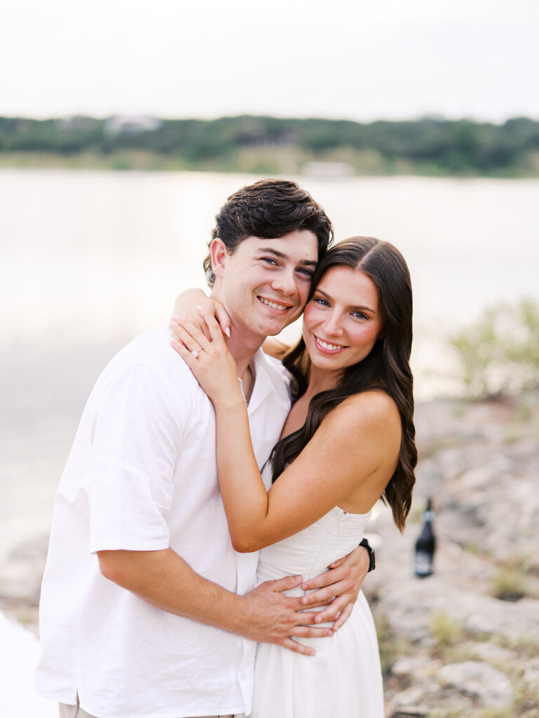 Playful and candid Lake Travis proposal photography of newly engaged couple enjoying the moment together.