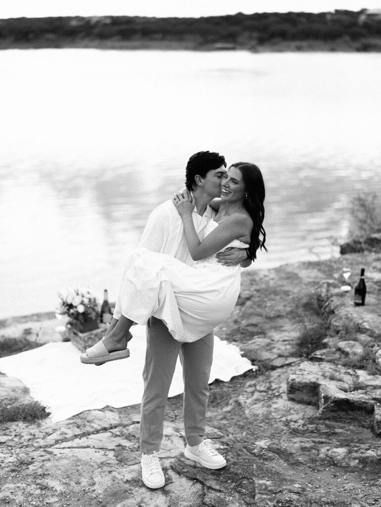 Playful and candid Lake Travis proposal photography of newly engaged couple enjoying the moment together.