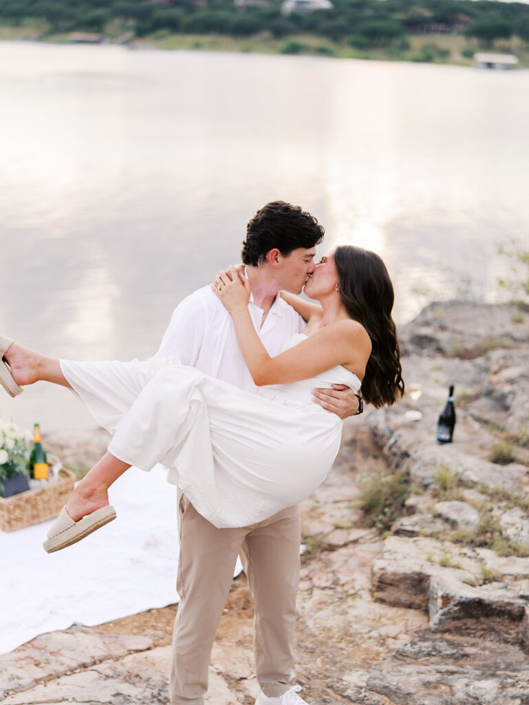 Playful and candid Lake Travis proposal photography of newly engaged couple enjoying the moment together.