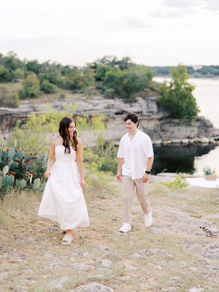 Playful and candid Lake Travis proposal photography of newly engaged couple enjoying the moment together.